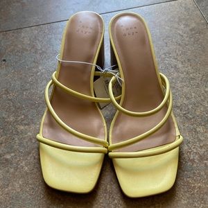 A new day yellow heeled sandals. NWT never worn.